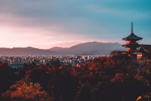 Picture of a Japanese building and a cityscape.